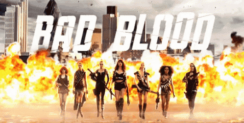 a group of women standing in front of an explosion with the words bad blood