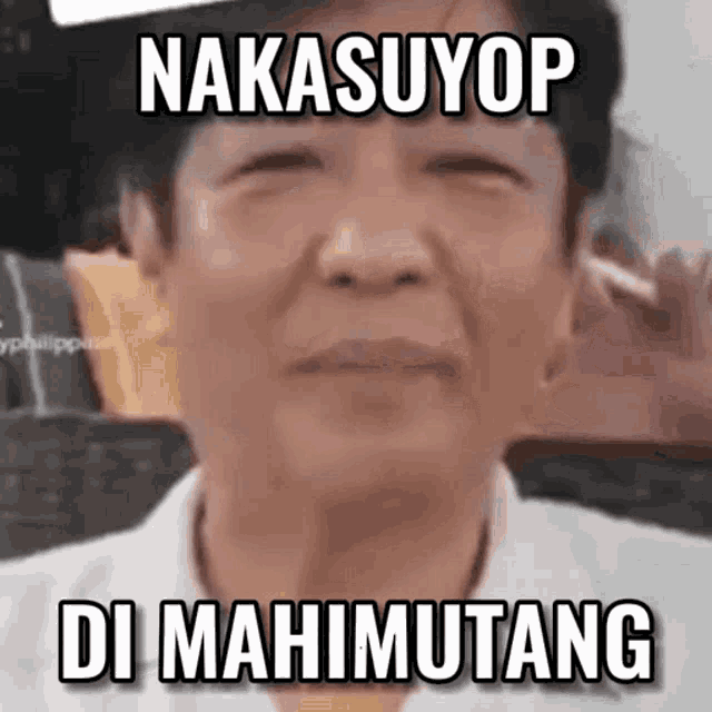 a close up of a man 's face with a caption that says nakasuyop di mahimutang .