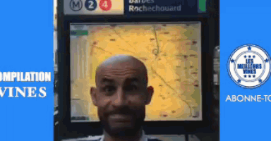 a man is standing in front of a sign that says rochechouard