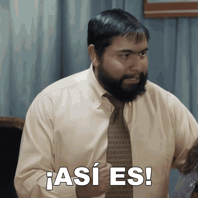 a man with a beard is wearing a shirt and tie and says " así es " on the bottom