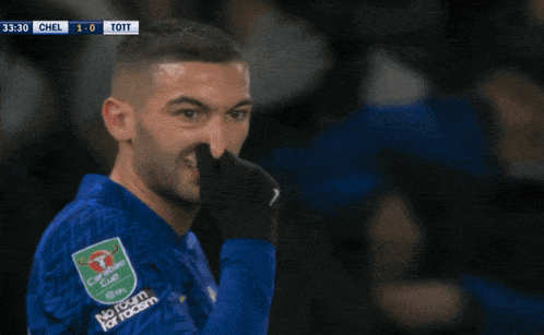 a soccer player wearing a blue jersey that says carabao cup on the front