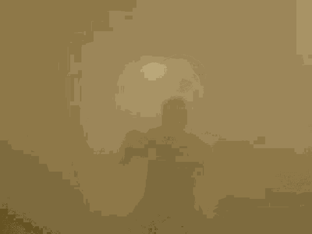 a man is standing in a dark room holding a gun in his hand .