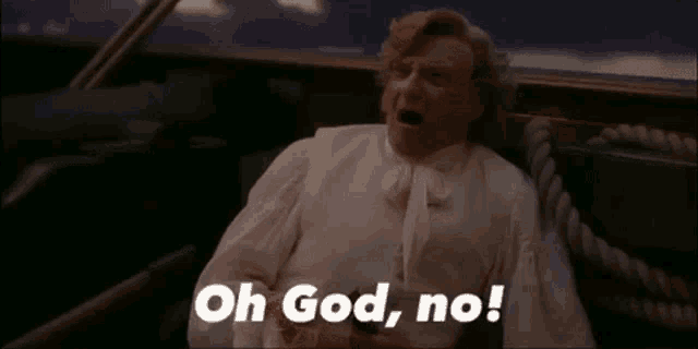 a man in a white shirt is sitting on a boat and saying `` oh god , no '' .