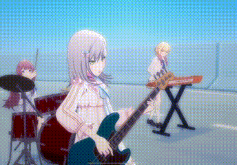 a girl is playing a guitar in a band while another girl plays drums .