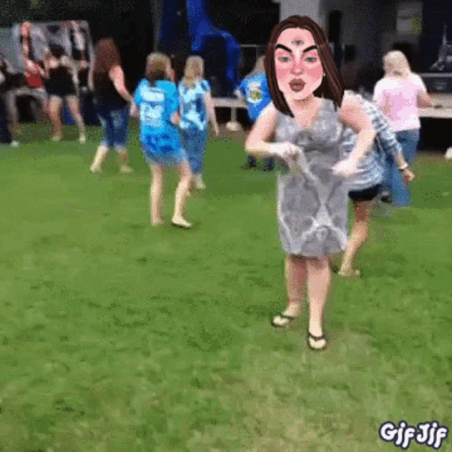 a group of women are dancing in a field with a gif jif watermark