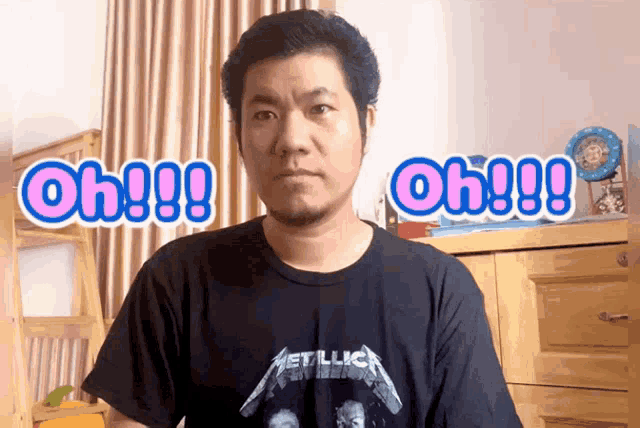 a man wearing a black metallica shirt says oh !!