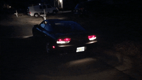 a black car with a license plate that says rxm 235