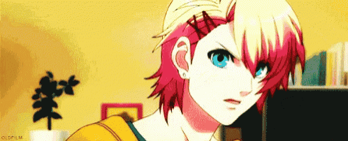 a girl with red hair and blue eyes is standing in front of a yellow wall .