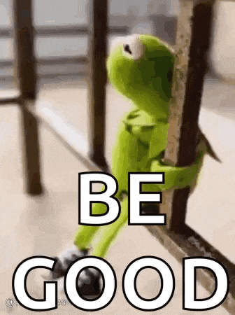 kermit the frog is sitting on a railing and holding onto a railing .