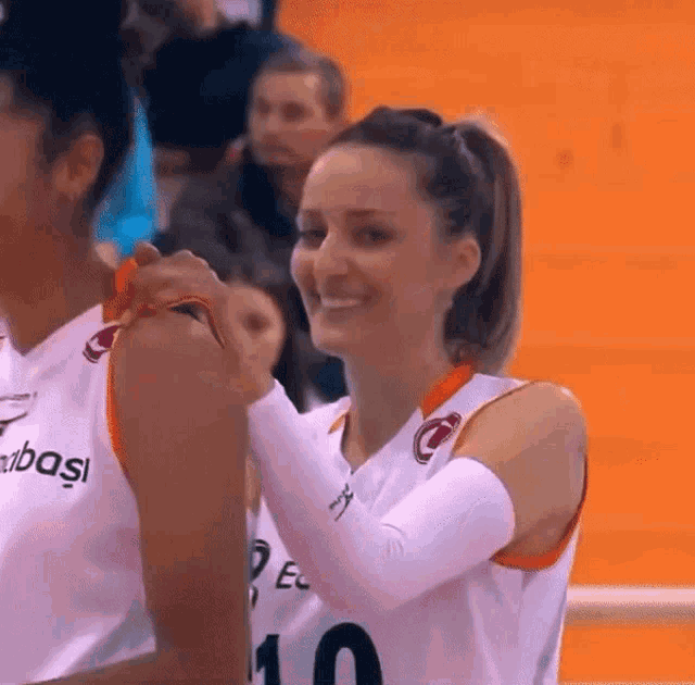 a female basketball player with the number 10 on her shirt
