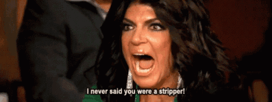 a woman is screaming with her mouth open and says i never said you were a stripper .