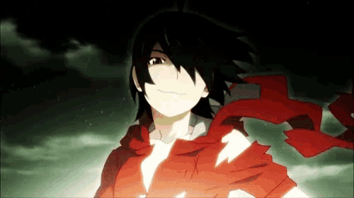 a man with a red scarf around his neck is smiling