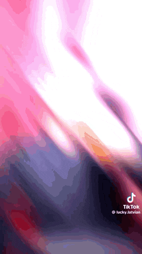 a tiktok video of a person 's feet with a pink background