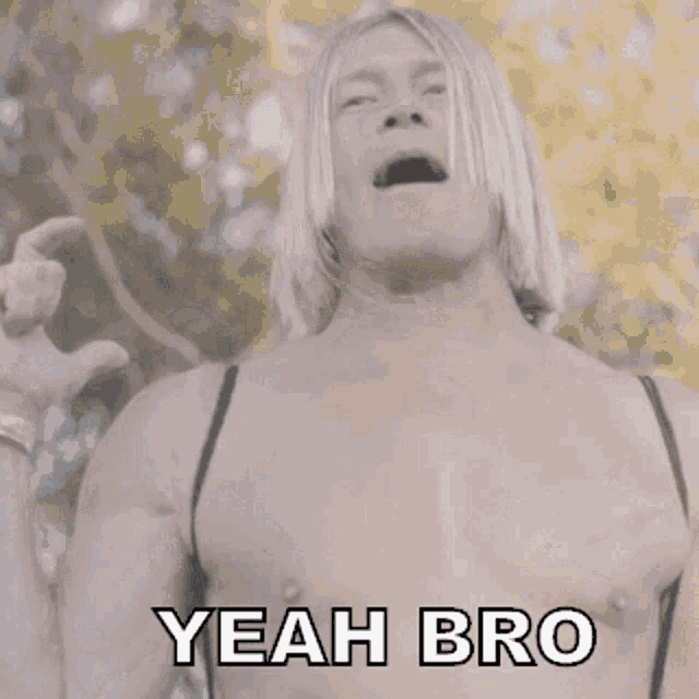 a shirtless man says " yeah bro " while wearing a bra
