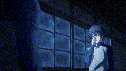 a man with glasses is standing in front of a window