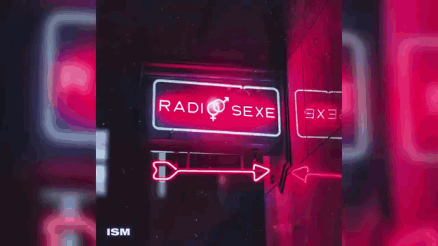 a neon sign that says radio sexe is lit up