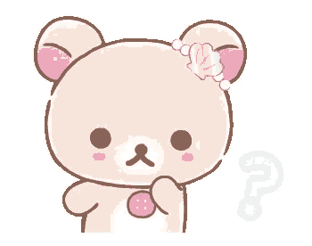 a pink teddy bear with a question mark on its chest .