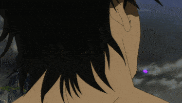 a close up of a person 's back with a purple dot in the middle