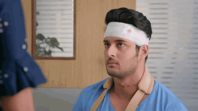 a man with a bandage on his head and neck