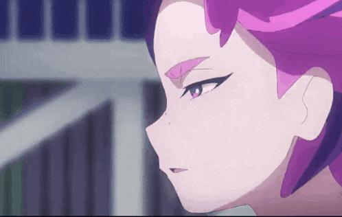a close up of a person 's face with pink hair