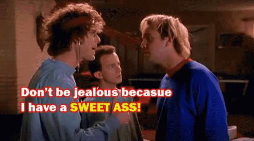 a man says " don 't be jealous because i have a sweet ass " while another man looks on