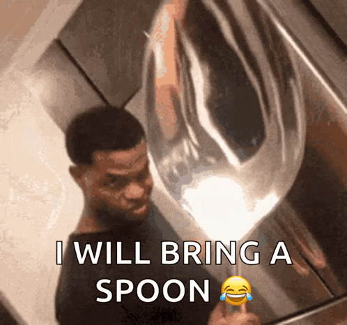 a man is holding a spoon in front of a mirror and says i will bring a spoon
