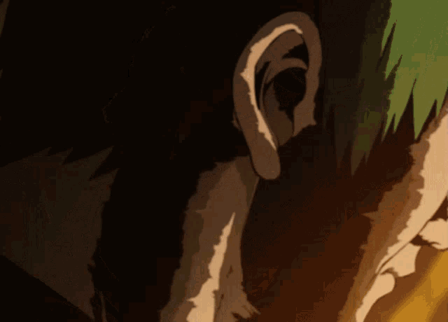 a close up of a person 's ear in a dark room