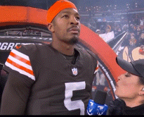 a football player with the number 5 on his jersey is being interviewed