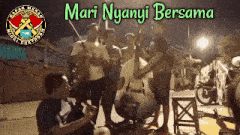 a group of men playing instruments with the words mari nyanyi bersama on the bottom