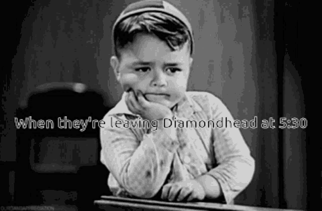 a black and white photo of a boy with the caption " when they re leaving diamondhead at 5:30 "
