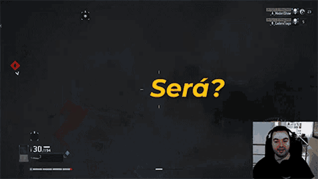 a man playing a video game with the words " sera " in yellow