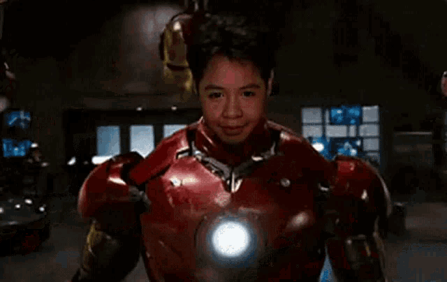a close up of a person wearing a iron man suit .