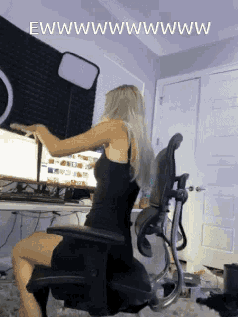 a woman in a black dress sits in front of a computer with the words " ewwwwwwwww " written above her