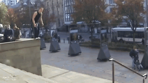 a man is doing a trick on a skateboard on a street