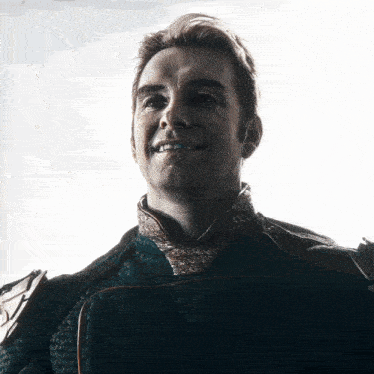 a close up of a man 's face with a white background behind him