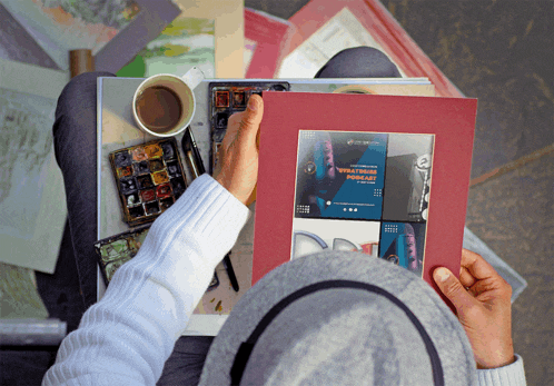 a person is holding a framed picture that says " vibrations "