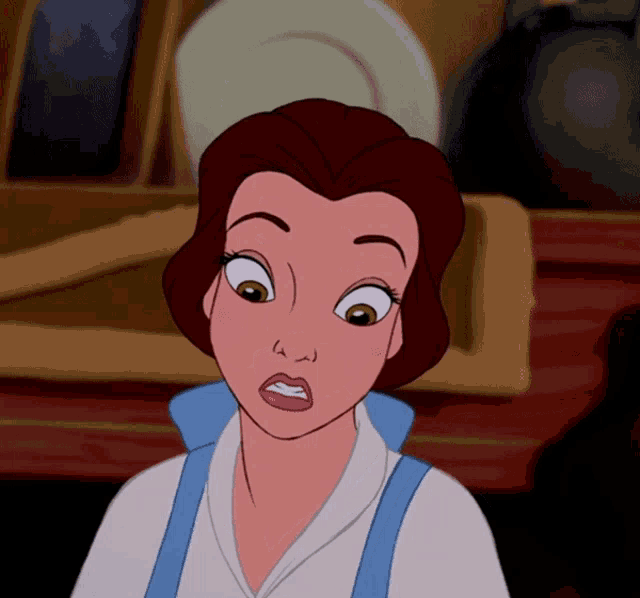 a close up of belle from beauty and the beast with a surprised look on her face