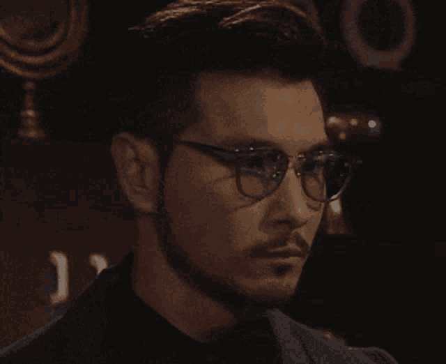 a blurry photo of a man wearing sunglasses