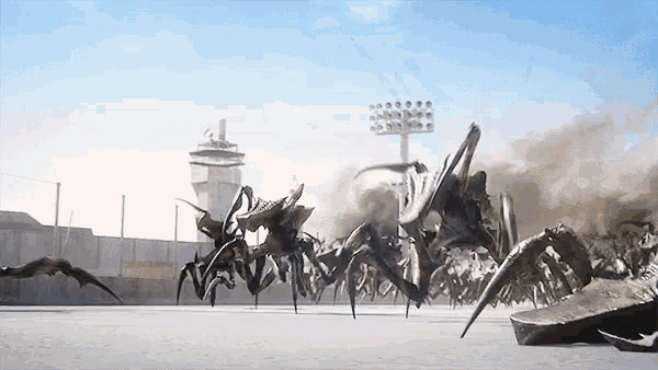 a bunch of bugs are crawling on the ground in front of a building