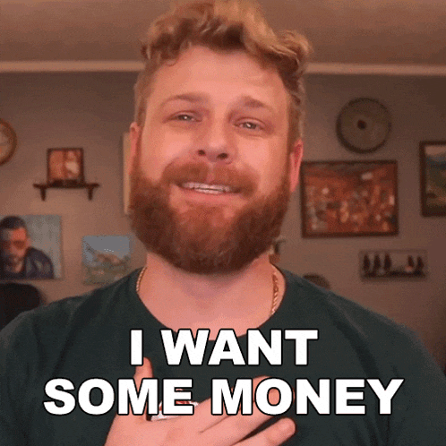 a man with a beard is smiling and says i want some money