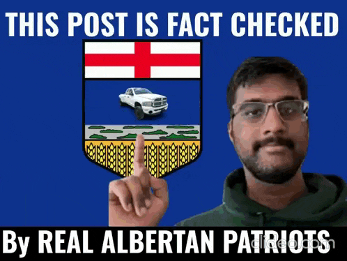 a man is pointing at a picture of the alberta flag