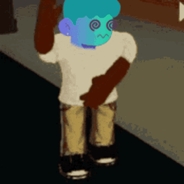 a cartoon character with a blue face and brown arms is standing on a sidewalk
