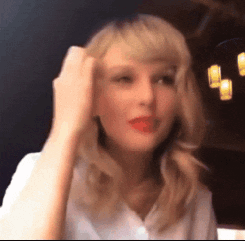 a close up of a woman 's face with a blurry background