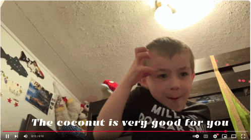a video of a young boy with the words " the coconut is very good for you " at the bottom