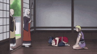a group of people are kneeling down in a room with a monk standing behind them