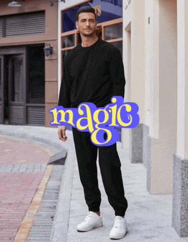 a man wearing a black sweatshirt and sweatpants stands in front of a sign that says magic 8