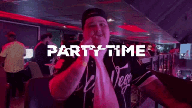 a man in a vegas jersey is standing in front of a sign that says partytime