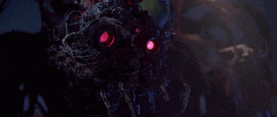 a close up of a robot with red eyes