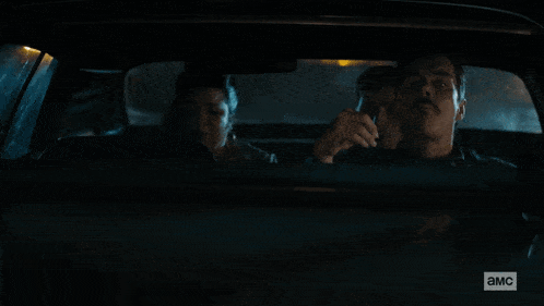 a man in a car says " what 's happening " while smoking a cigarette