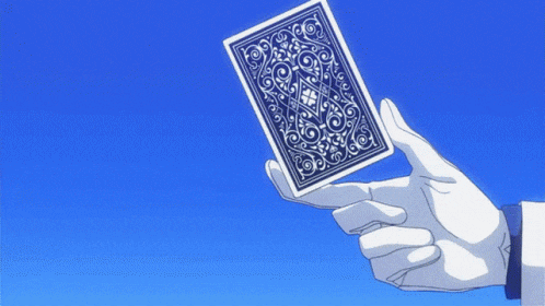 a person in white gloves is holding a playing card